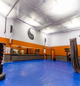 SmartSeam installation over blue karate mats to prevent dirt from spilling over the mats. This is attached to the daycare we are protecting during reroofing. 